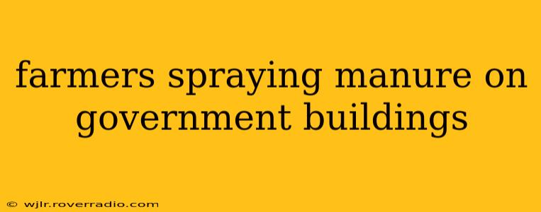 farmers spraying manure on government buildings